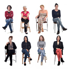 group of women sitting on chair on white background, front view