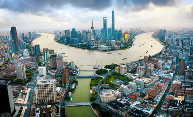 Wall Mural - Shanghai skyline aerial view with skyscrapers rising above Haung