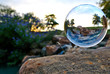 A glass orb floats in a park in Frisco, TX.