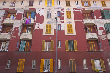 Europe , Italy , Milan april 2020 -  public housing in Giambellino neighborhood in a state of neglect with falling walls during n-cov19 coronavirus epidemic outbreak - poor people home 