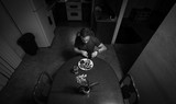 Fototapeta Tęcza - Man staying at home eating dinner alone while in quarantine during self isolation