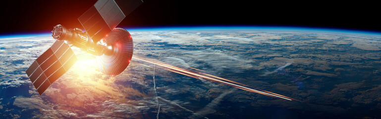 Wall Mural - space military satellite, a weapon in space shoots a laser against the background of the earth. atta