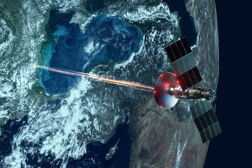 Wall Mural - space military satellite, a weapon in space shoots a laser against the background of the earth. atta