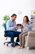 © Elnur - Pregnant woman visiting young male psychologist