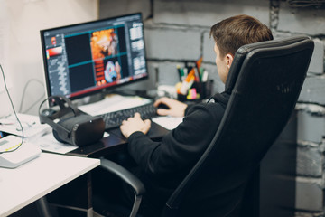 Wall Mural - Stay home. Working home. Programmer with virtual reality headset, VR glasses with joystick with personal computer.