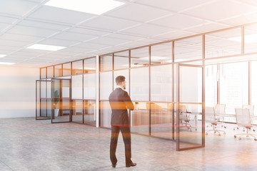 Wall Mural - Businessman near white office meeting room