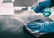 canvas print picture - Surface sanitizing against COVID-19 outbreak. Home cleaning spraying antibacterial spray bottle disinfecting against coronavirus wearing nitrile gloves. Sanitize hospital surfaces prevention.