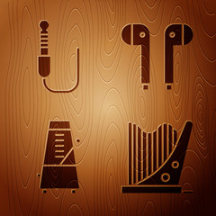 Poster - Set Harp, Audio jack, Metronome with pendulum in motion and Air headphones on wooden background. Vector