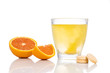 Series of orange flavored vitamin c effervescent tablet dropped and dissolve in glass of water