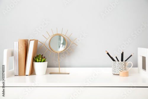 Fotografía Modern stylish workplace near grey wall