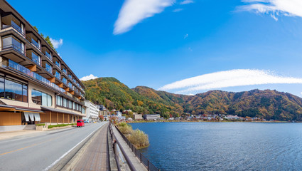 Wall Mural - Japan. Hotels on the coast of Kawaguchiko. Kawaguchiko lake on a summer day. Lake in Japan on the background of blue sky. Traveling in the regions of Japan. The road along the lake. Nature. Scenery