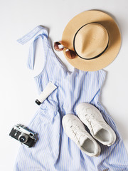 Wall Mural - Fashion vacation flat lay with blue  summer dress, hat, sneakers, sunglasses and other accessories