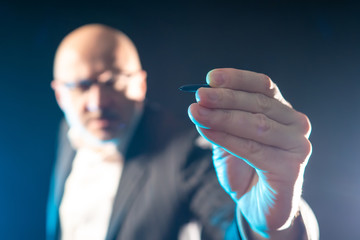 Poster - hand of a man with a stylus close-up. device for controlling touch screens. accessories for smartpho