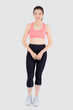© NT_studio - Beautiful portrait young asian woman in sport clothes with satisfied and confident isolated on white background, asia girl cheerful have shape and wellness, exercise for fit with health concept.
