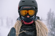 © Annatamila - Portrait of snowboarder with board wearing mask in snowy winter landscape outdoors