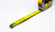 © rarrarorro - retractable yellow metal measuring tape. Measurements expressed in centimeters and feet.