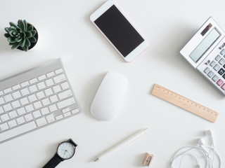 Poster - top view of work from home concept with keyboard, calculator and notebook on white background, graphic designer, Creative Designer concept.