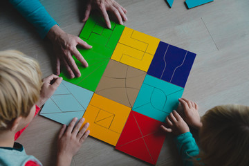 Poster - teacher and kids play with puzzle, doing tangram