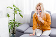 Portrait of adult woman using steam vapor inhaler nebulizer doing aerosol inhalation medicine treatment at home or hospital flu and asthma bronchitis virus healing