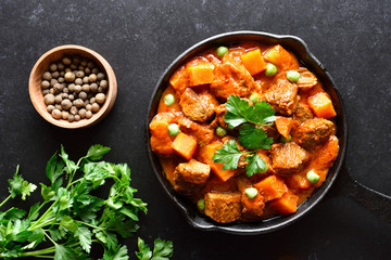 Wall Mural - Beef stew with potatoes and carrots in tomato sauce