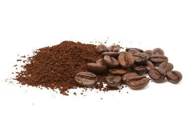 Ground coffee and coffee beans isolated on white background.