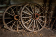 old wooden wagon wheels in shed
