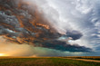 Leinwandbild Motiv storm clouds over a field