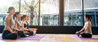 © Kawee - Group of multi ethnics people learning Yoga class in fitness club. Female Asian instructor coaching meditation pose to Caucasian and mix race students to follow correct posture for health. Banner size
