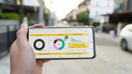 Business man analysis graph visualization on mobile for anywhere anytime