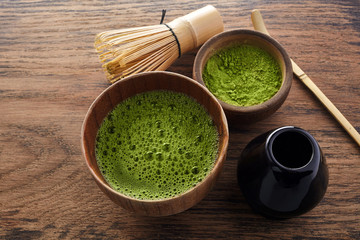 Wall Mural - Set with green matcha tea on wooden background. Japanese tea ceremony. Food menu background. Tea ceremony set.