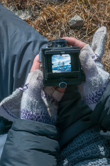 Wall Mural - look at the mountain scenery through the viewfinder of an old camera