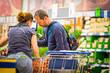 © simona - Adult caucasian couple buy food and articles in supermarket mall store - concept of storage for pandemic epidemic virus contagion quarantine at home