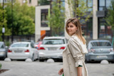 Fototapeta Konie - smiling girl walking in the street city 