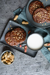 Wall Mural - Brownie cookies topped with melted chocolate and chopped peanuts