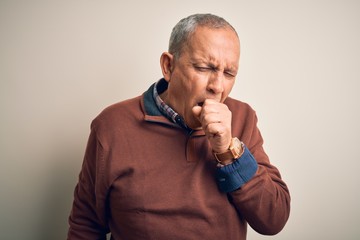 Sticker - Senior handsome man  wearing elegant sweater standing over isolated white background feeling unwell and coughing as symptom for cold or bronchitis. Health care concept.