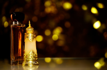 glass perfume bottle dark background 