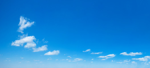 Wall Mural - blue sky background. natural background. panorama sky with tiny clouds