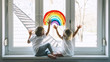 © nataliaderiabina - Little children on background of painting rainbow on window