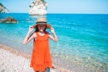 Cute little girl at beach during summer vacation