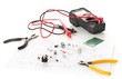 © Shawn Hempel - Different electronic parts or components, measurement tool and pliers on white with pcb wiring diagram, resistors, capacitors, diode and ic chips, selective focus