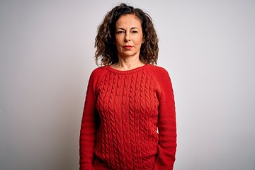 Wall Mural - middle age brunette woman wearing casual sweater standing over isolated white background relaxed wit
