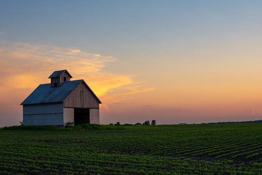 rural sunset and barn with vibrant colors. la salle county, illinois.