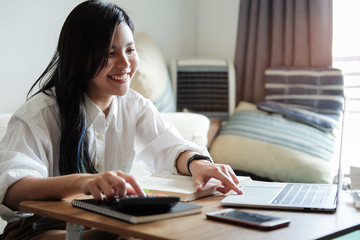 
Business women work from home living room enjoying sunny morning on the day with documents and laptop people Consulting and business planning. 