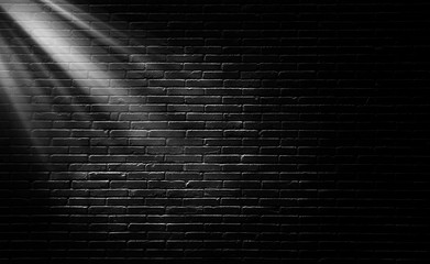 Wall Mural - abstract image of empty space black brick wall grunge texture background with light shading on wall.