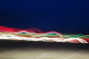 Moving lights against a night sky