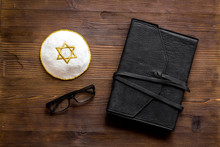 Jewish Kippah Yarmulkes Hats With Star Of David Near Prayer Book On Wooden Desk Top View