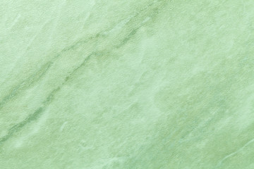Wall Mural - texture of light green marble with olive lines of a pattern, macro background.