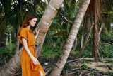 Fototapeta Las - young woman in a tropical forest