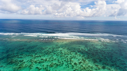 Wall Mural - Tropical beach and sea with blue sky background. Aerial view.