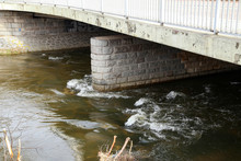 The Rapid Flow Of The River Under The Bridge